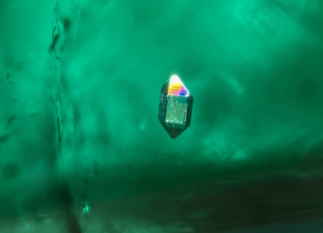 Double-terminated-quartz-crystal-in-a-Colombian-emerald