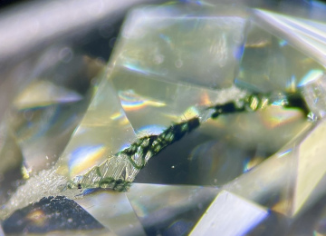 Green-colouration-from-natural-irradiation-remains-on-the-girdle-of-this-green-diamond-after-being-cut