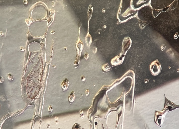 Heat-treatment-in-this-sapphire-has-caused-the-negative-crystals-to-deform