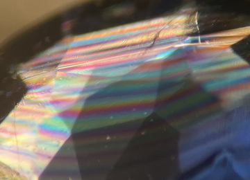 Interference-colours-seen-across-twinning-planes-in-a-sapphire-under-crossed-polars-