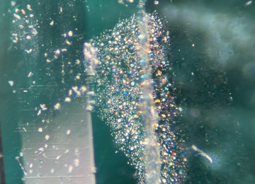Irridescent-thin-film-inclusions-in-a-Russian-emerald