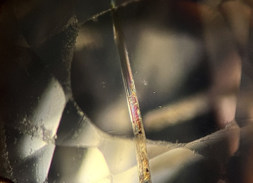 Large-needle-like-crystal-possibly-pargasite-in-a-suspected-Kashmir-sapphire