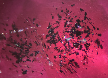 Profusion-of-small-dark-crystals-in-a-ruby