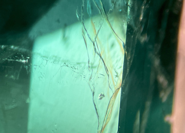 Subtle-yellow-and-blue-flashes-in-the-fissure-of-this-Colombian-emerald-provide-evidence-of-resin-treatment
