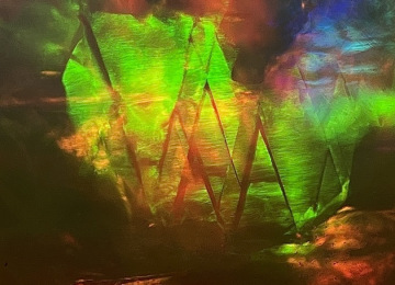 Vibrant-play-of-colour-with-sharp-angular-growth-features-in-a-natural-opal